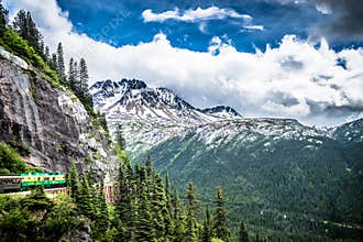 The White Pass and Yukon Route on train passing through vast lan