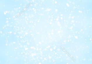 Abstract glitter white circles shape bokeh on light blue background.