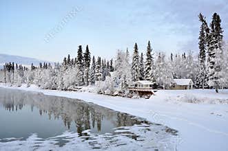 Alaska House on the River in Winter