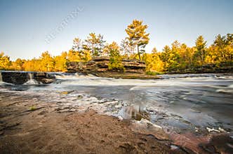 Flowing Kettle River in Banning State Park in Minnesota during the fall. Long exposure