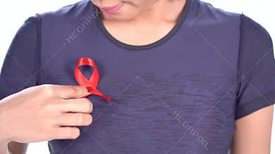 Woman with world AIDS day awareness ribbon