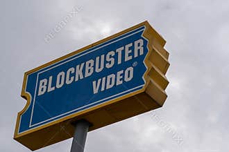 Sign for Blockbuster Video movie rental store. Close up view, overcast day