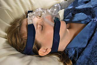 Woman with CPAP Mask