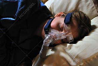 Woman with CPAP Mask