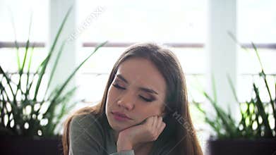 Portrait of sleepy woman at morning indoors