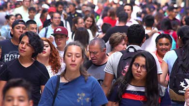 SLOW MOTION-TAKE 9: Crowd walking through street. In Mexico the population growing is a public problem due the high birth rates.