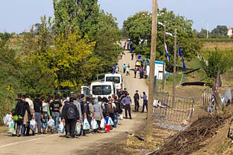 Refugees walking towards the Croatian border crossing on the Croatia Serbia border, between the cities of Bapska and Berkasovo