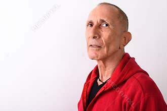 Close up of bald senior man wearing red hoodie against white bac