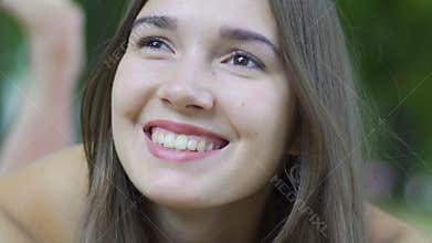 Happy woman smiles outdoors, beautiful female feels joy happiness, enjoys life