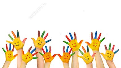 Group of happy children raises hands up.
