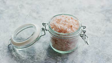 Glass jar with pink salt