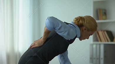 Business lady feeling lower back pain, nerve inflammation, sedentary life result