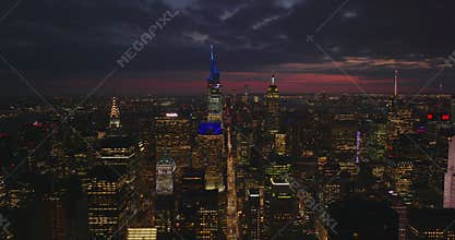 Aerial panoramic static shot of downtown skyscrapers at night. One Vanderbilt and Empire State Building against