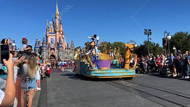 A parade coming down Main Street USA in the Magic Kingdom at Disney World