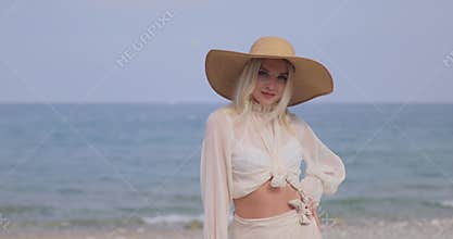 Woman in Elegant Beach Outfit Outdoors Against Sea Background During Summer Vacations