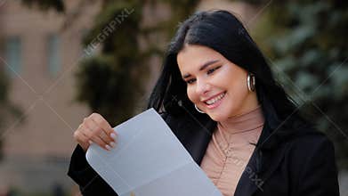 Portrait hispanic young woman read good news post mail happy smiling female got dream job career growth promotion at