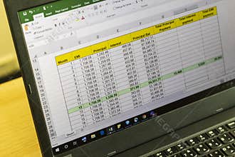 Shot of an excel sheet on computer screen showing bank loan amortization table. Accounting