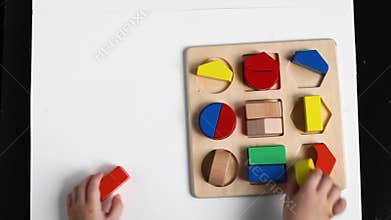 The boy is playing in his room