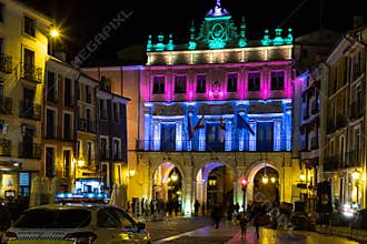 Facade illuminated with bright colored lights. Cuenca. Spain