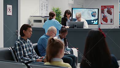 Waiting room in hospital lobby with reception counter desk