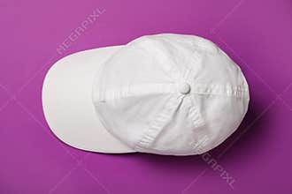 Baseball cap on purple background, top view. Mock up for design
