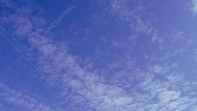 Cirrus clouds in the blue sky in early spring.