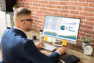 Business Data Analyst Using Desktop Computer