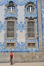 Blue and white tiles and man in red