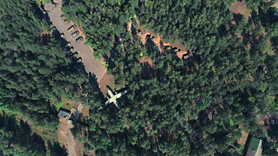 Top view spy drone shooting a russian military base with airplanes