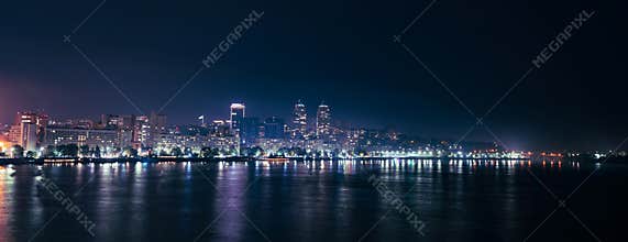 Big Dnieper river in the huge night bright city of Dnipropetrovsk in Ukraine