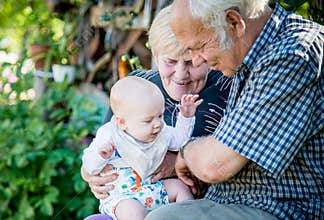 Grandparents and grandson  happy smiling family met again