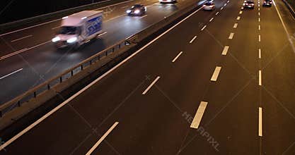 Cars driving on the highway at night
