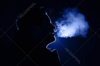 Man exhaling warm breath