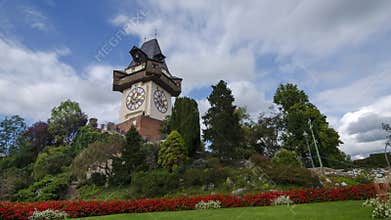 The famous clock tower and gardens on Schlossberg hill, tourist attraction in Graz, Styria region, Austria, 4K timelapse