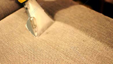 Dry cleaning of the sofa with professional equipment. Professional wet cleaning of the sofa from dirt and stains. Concept of clean