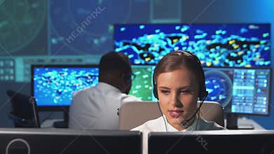 Workplace of the air traffic controllers in the control tower. Diverse team of aircraft control officers works using