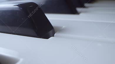 Extreme close-up, detailed. black and white piano keys