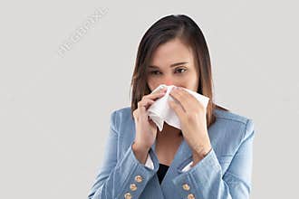 Woman with allergy, holding tissue