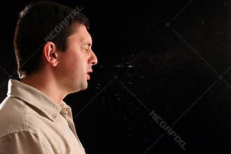 Guy sneezing