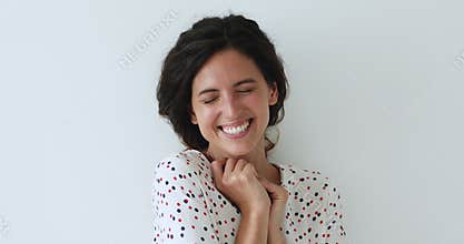 Overjoyed millennial woman laughing at funny joke.