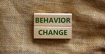 Time to behavior change symbol. Wooden blocks with words `behavior change`. Beautiful canvas background. Copy space. Business,