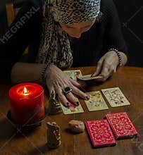 A fortune teller reads the tarot cards to predict the future