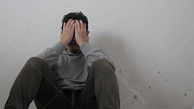 Sad depressed anxiety Asian man thinking contemplating bad thing happened in his life, stress exhausted feeling down expression,