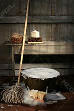 Old wash bucket with mop and brushes