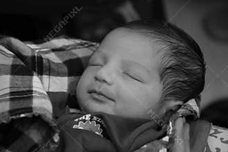 New born asian baby girl on her mother's hand