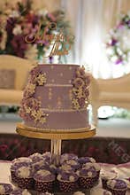 Purple wedding cakes with couple names on top