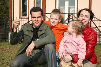 Family with house key
