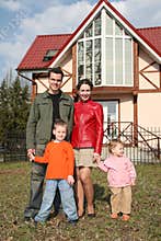 Family of four near house