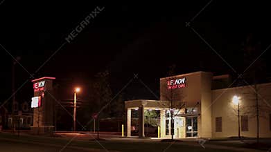 Mednow medical prompt care at night with traffic and street lights