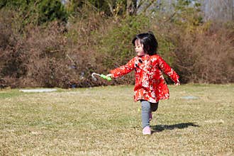 Happy bubble run Chinese girl